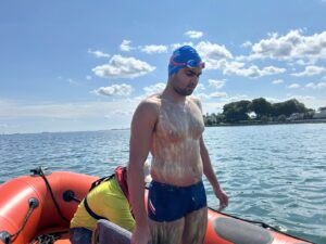 Aryan Dadiala prepares with grease before swim