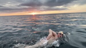 ben taylor swimming at sunrise