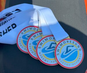finisher medals for swim oresund relay event